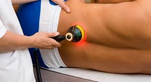 Thor phototherapy device being used to treat lower back inflammation and pain.