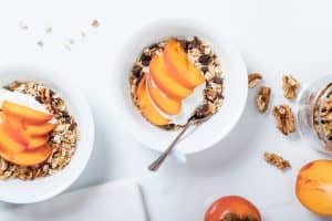 cereal with dried fruit, nuts, fresh apricots and yogurt
